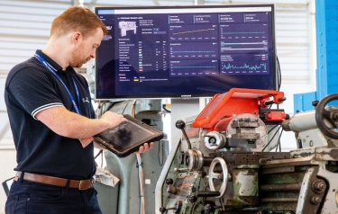 AMRC Project Manager, Gavin Hill, with a 1956 Colchester Bantam lathe retro-fitted with ultra-low cost sensing equipment; a recent example of the AMRC demonstrating how legacy machine tools can also be adapted to meet the challenges of Industry 4.0