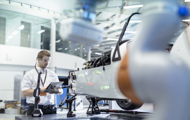 Project engineer in the AMRC's Integrated Manufacturing Group (IMG), James Lindsay, with the development Caterham sports car (Credit: AMRC)