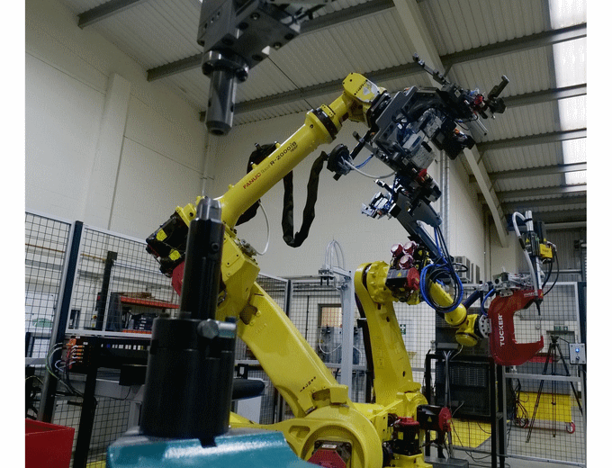 The two robots in cell 1, work in harmony feeding the respective fastening and riveting stations